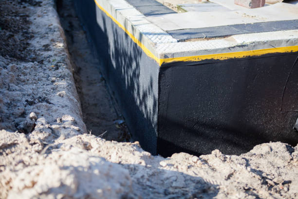 Professional Waterproofing technician working in Helmetta, NJ